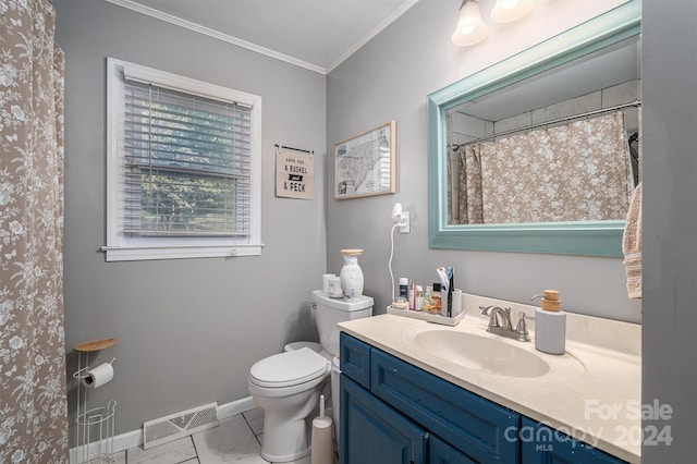 bathroom featuring ornamental molding, vanity, and toilet