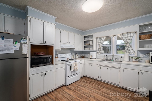 kitchen with wood-type flooring, ornamental molding, white cabinets, and appliances with stainless steel finishes