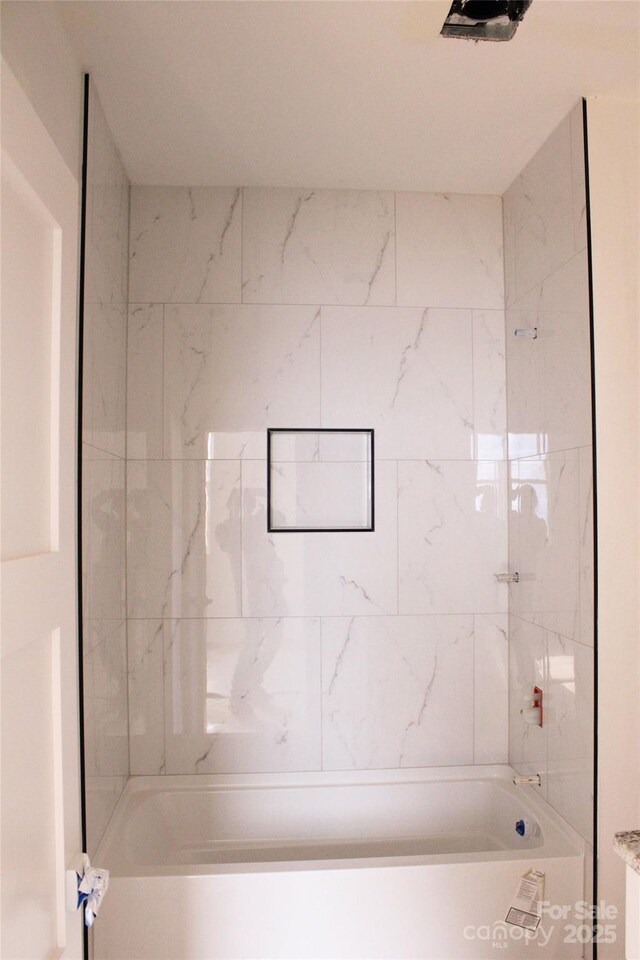 bathroom featuring  shower combination