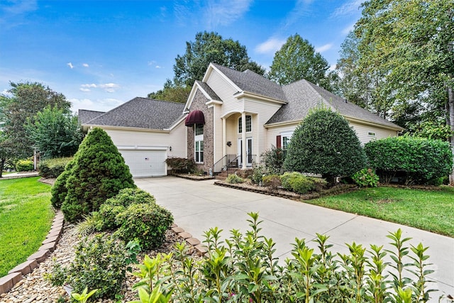 front facade featuring a front lawn and a garage