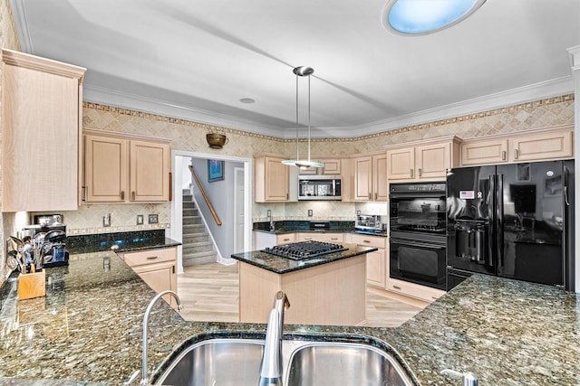 kitchen with dark stone countertops, a sink, black appliances, light brown cabinetry, and backsplash