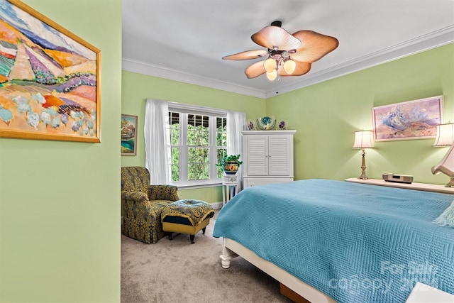 bedroom featuring ornamental molding, ceiling fan, and light colored carpet