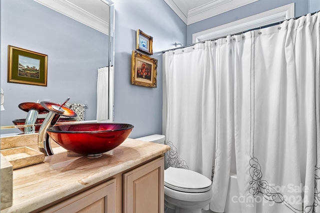 full bathroom with shower / tub combo, toilet, vanity, and crown molding