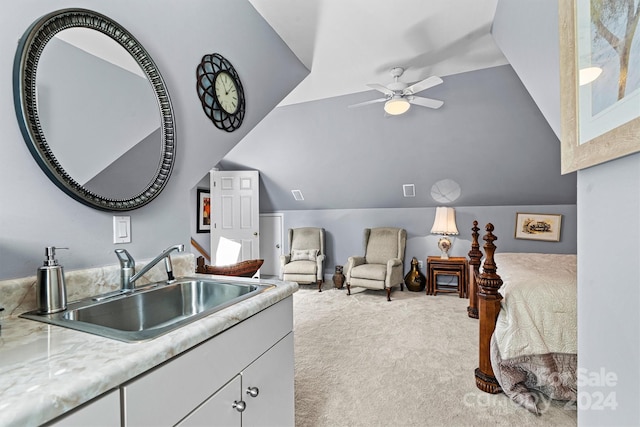 carpeted bedroom with lofted ceiling, ceiling fan, and sink