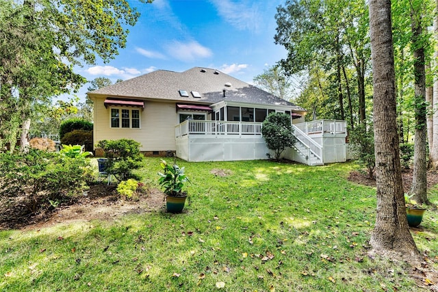 back of house with stairway, crawl space, a lawn, a deck, and a sunroom