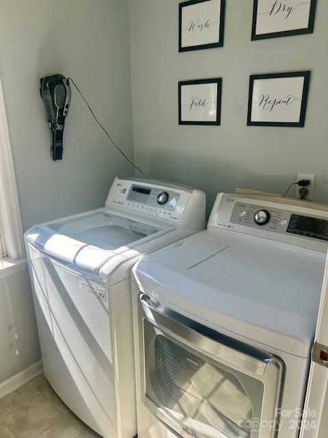 laundry room with washer and dryer