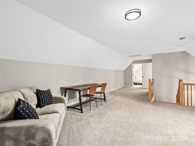 interior space featuring light carpet and lofted ceiling