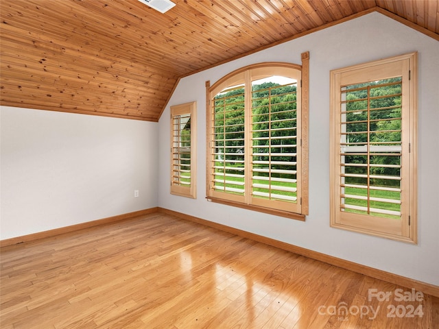 interior space featuring light hardwood / wood-style flooring, wood ceiling, and vaulted ceiling