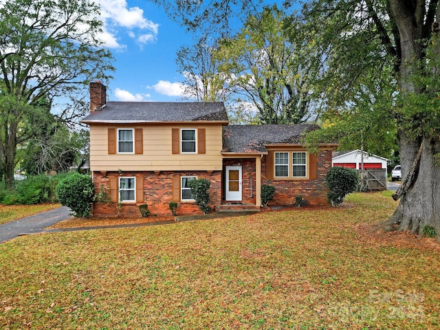 split level home with a front yard