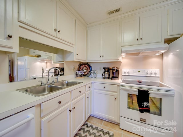 8510 Olive Branch Rd, Marshville, NC 28103 - kitchen with white appliances, under cabinet range hood, a sink, light countertops, and white cabinets