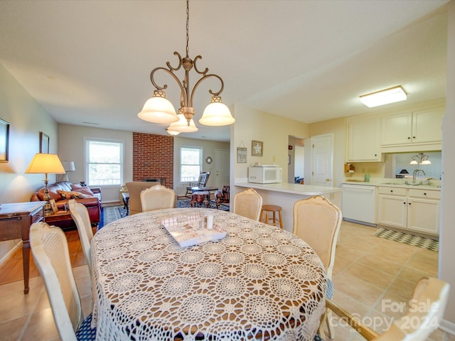 8510 Olive Branch Rd, Marshville, NC 28103 - dining space with light tile patterned flooring and a chandelier