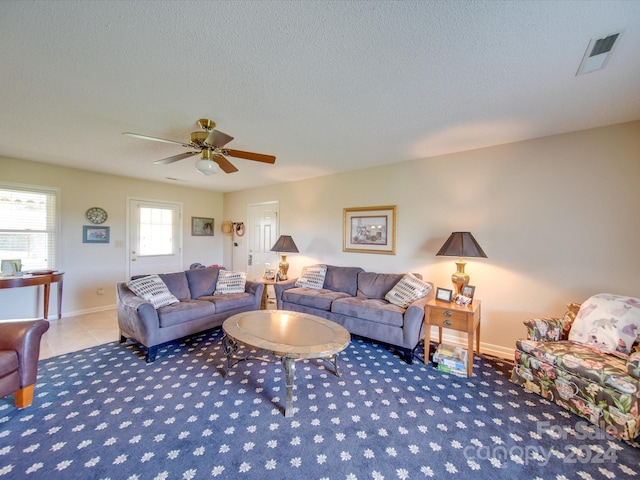8510 Olive Branch Rd, Marshville, NC 28103 - carpeted living area featuring a textured ceiling, ceiling fan, and baseboards