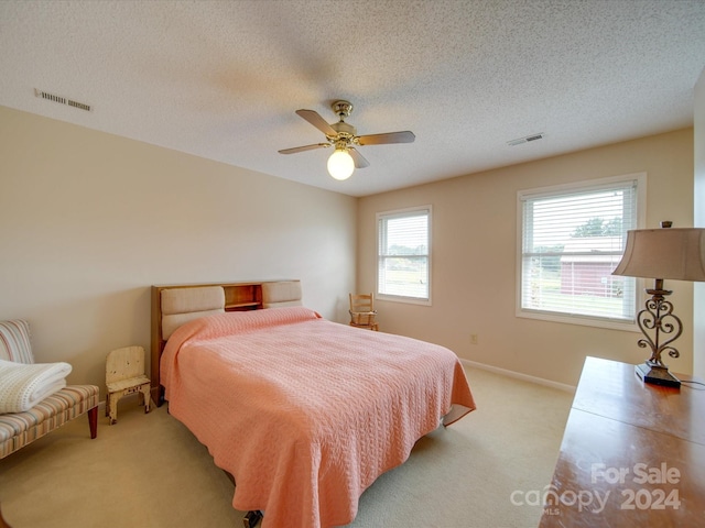 8510 Olive Branch Rd, Marshville, NC 28103 - bedroom with light carpet, a textured ceiling, a ceiling fan, and baseboards