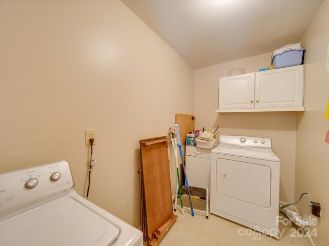 8510 Olive Branch Rd, Marshville, NC 28103 - washroom featuring cabinet space, washer and clothes dryer, and light carpet