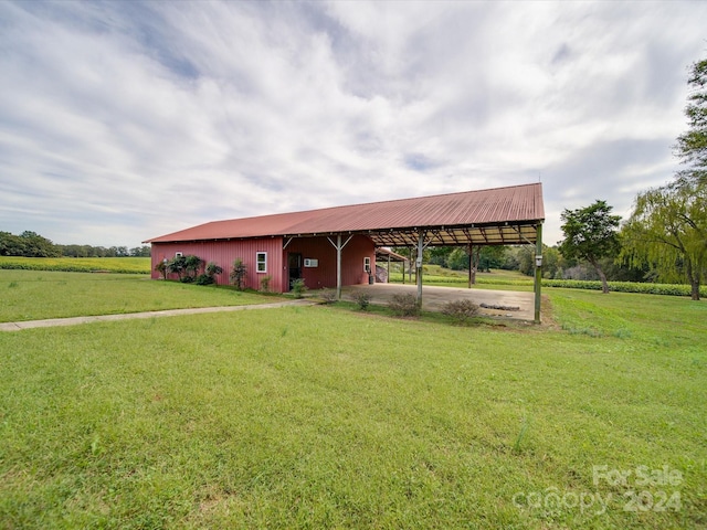 8510 Olive Branch Rd, Marshville, NC 28103 - view of home's community featuring a lawn, an outbuilding, a pole building, and an attached carport