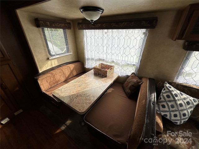 dining space with hardwood / wood-style flooring