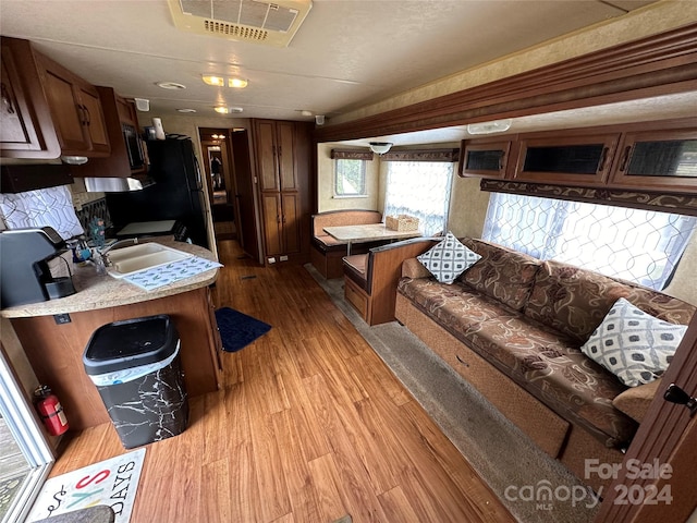 interior space with sink and light hardwood / wood-style flooring