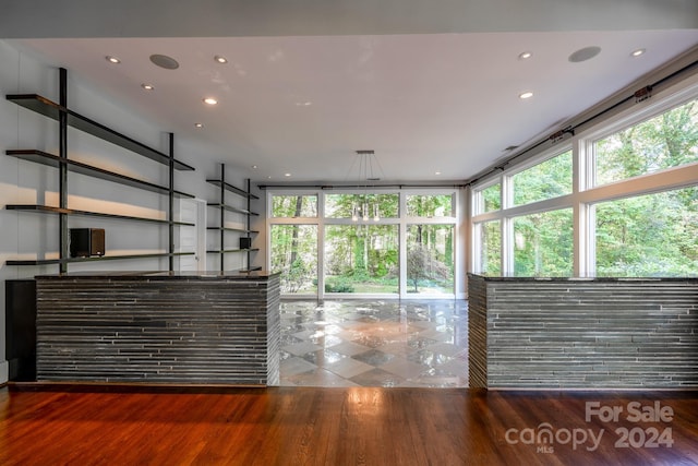 unfurnished living room with hardwood / wood-style floors