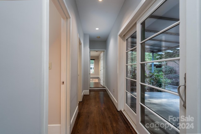 corridor featuring recessed lighting, dark wood-style floors, and baseboards