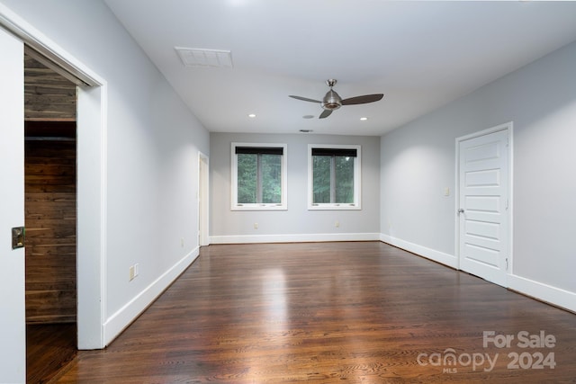 spare room with recessed lighting, baseboards, visible vents, a ceiling fan, and dark wood-type flooring