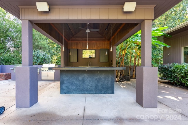 view of patio with a gazebo, area for grilling, ceiling fan, and exterior bar