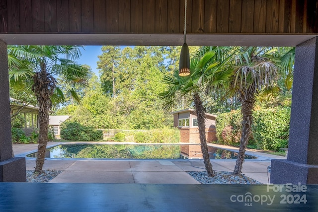 exterior space featuring a fenced in pool