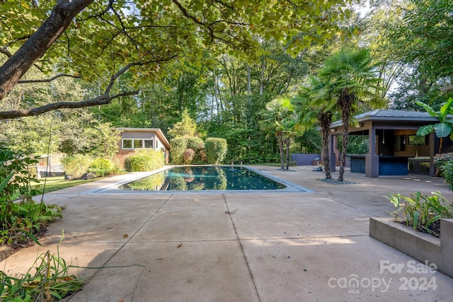 view of swimming pool featuring a gazebo and a patio area