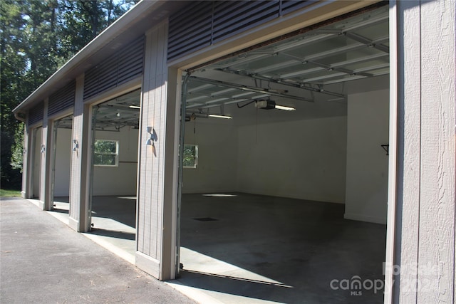 exterior space with a garage door opener