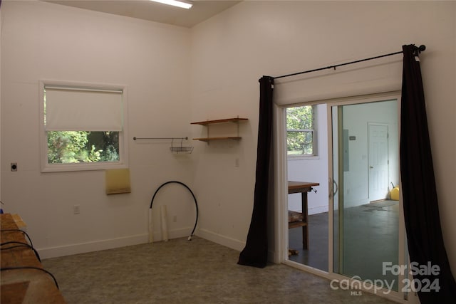 interior space with carpet flooring and baseboards