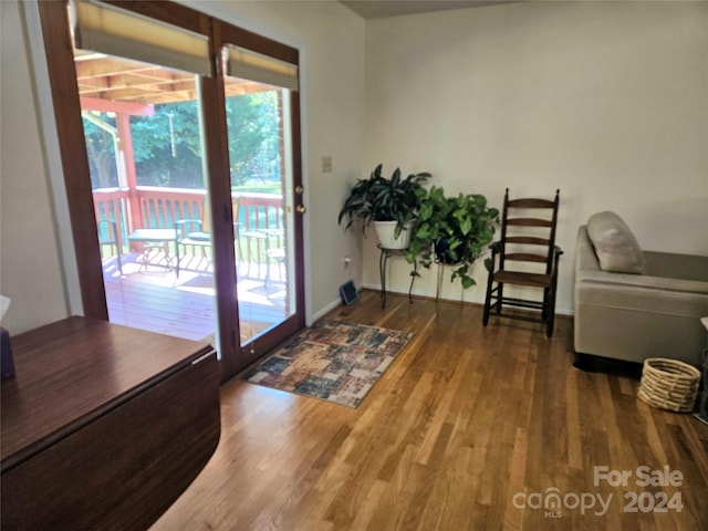 doorway to outside with hardwood / wood-style flooring