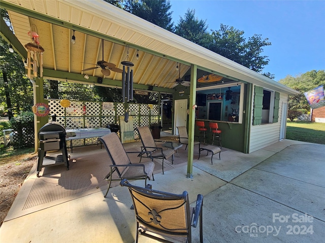 view of patio featuring ceiling fan