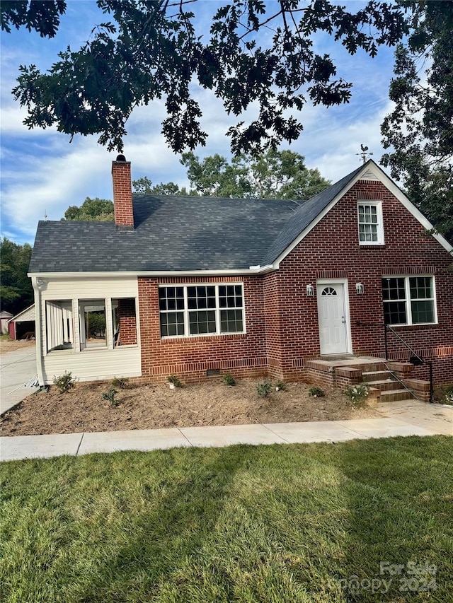 3980 Fish Pond Rd, Salisbury, NC 28146 - view of front facade featuring a chimney, a front yard, brick siding, and crawl space