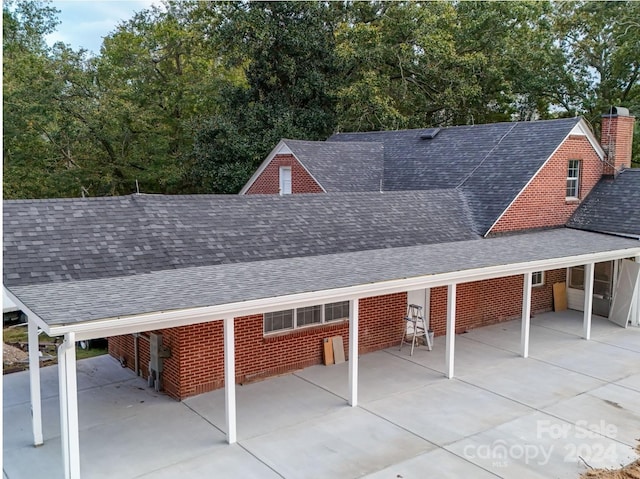 exterior space featuring a carport