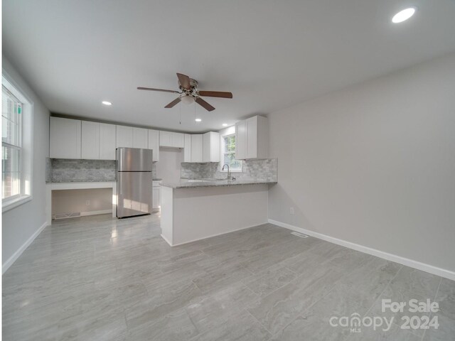 3980 Fish Pond Rd, Salisbury, NC 28146 - kitchen featuring freestanding refrigerator, a ceiling fan, backsplash, recessed lighting, and white cabinets
