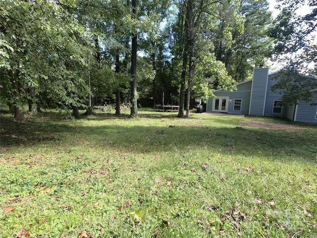 view of yard with a trampoline