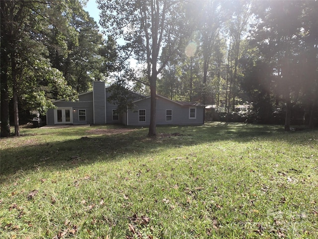 view of yard with french doors