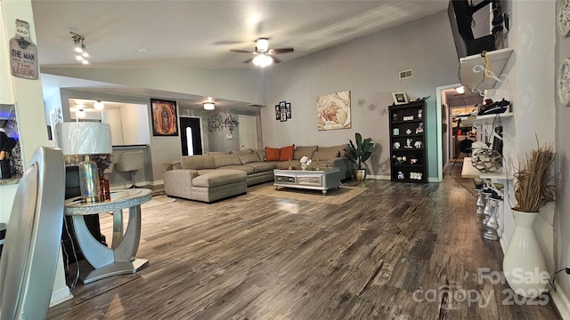 living room featuring wood-type flooring, vaulted ceiling, and ceiling fan