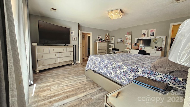 bedroom with light hardwood / wood-style flooring