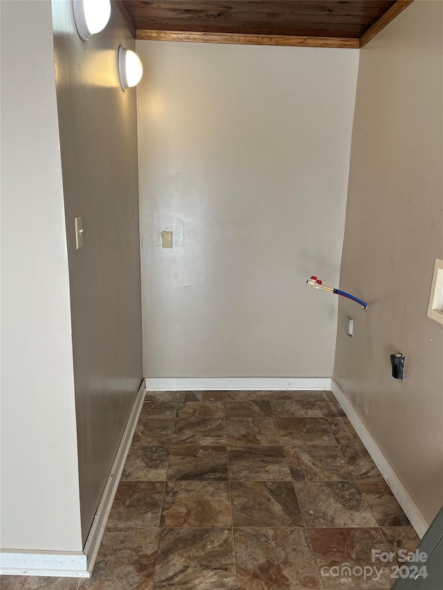 laundry room with hookup for a washing machine, crown molding, and wooden ceiling