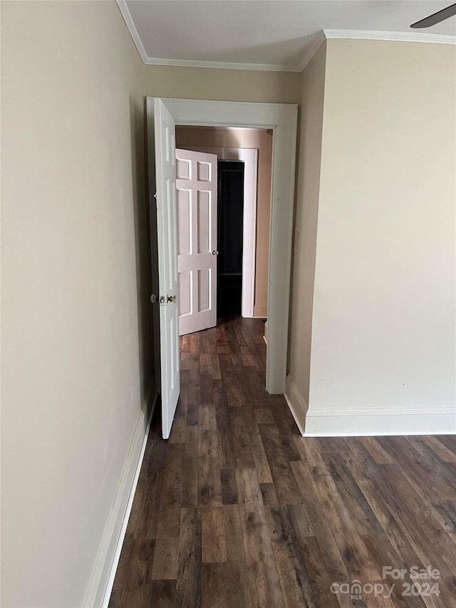 hall featuring crown molding and dark hardwood / wood-style flooring