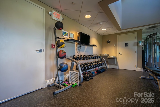 workout area with a drop ceiling