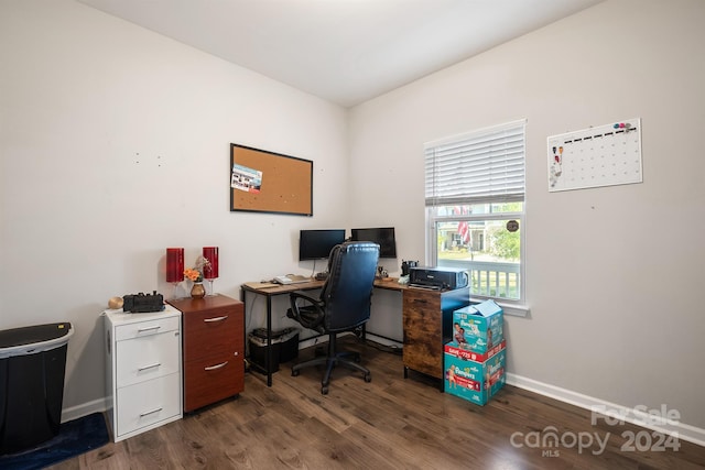 office with dark hardwood / wood-style floors