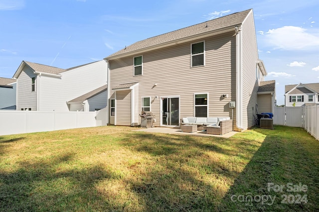 back of house featuring a patio, an outdoor living space, cooling unit, and a yard