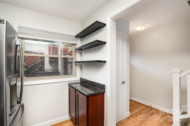 kitchen featuring stainless steel fridge and light wood-type flooring