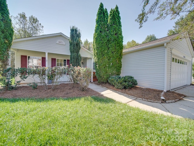 single story home featuring a front yard and a garage