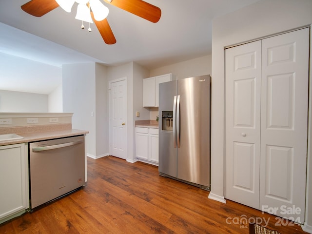 kitchen featuring ceiling fan, sink, white cabinetry, light hardwood / wood-style flooring, and appliances with stainless steel finishes