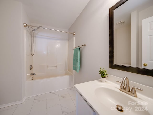 bathroom with tub / shower combination and vanity