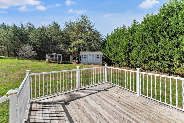 deck with a lawn and a storage shed