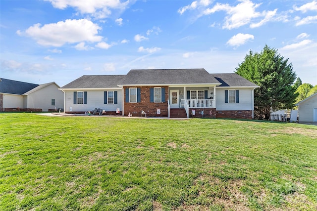 ranch-style home with a porch and a front yard