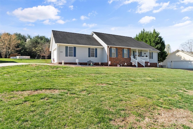 single story home featuring a porch and a front lawn